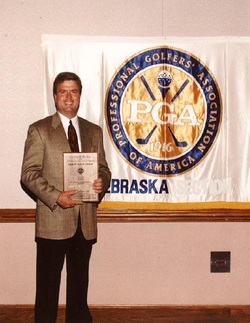 Dave Malone coaching a junior golfer